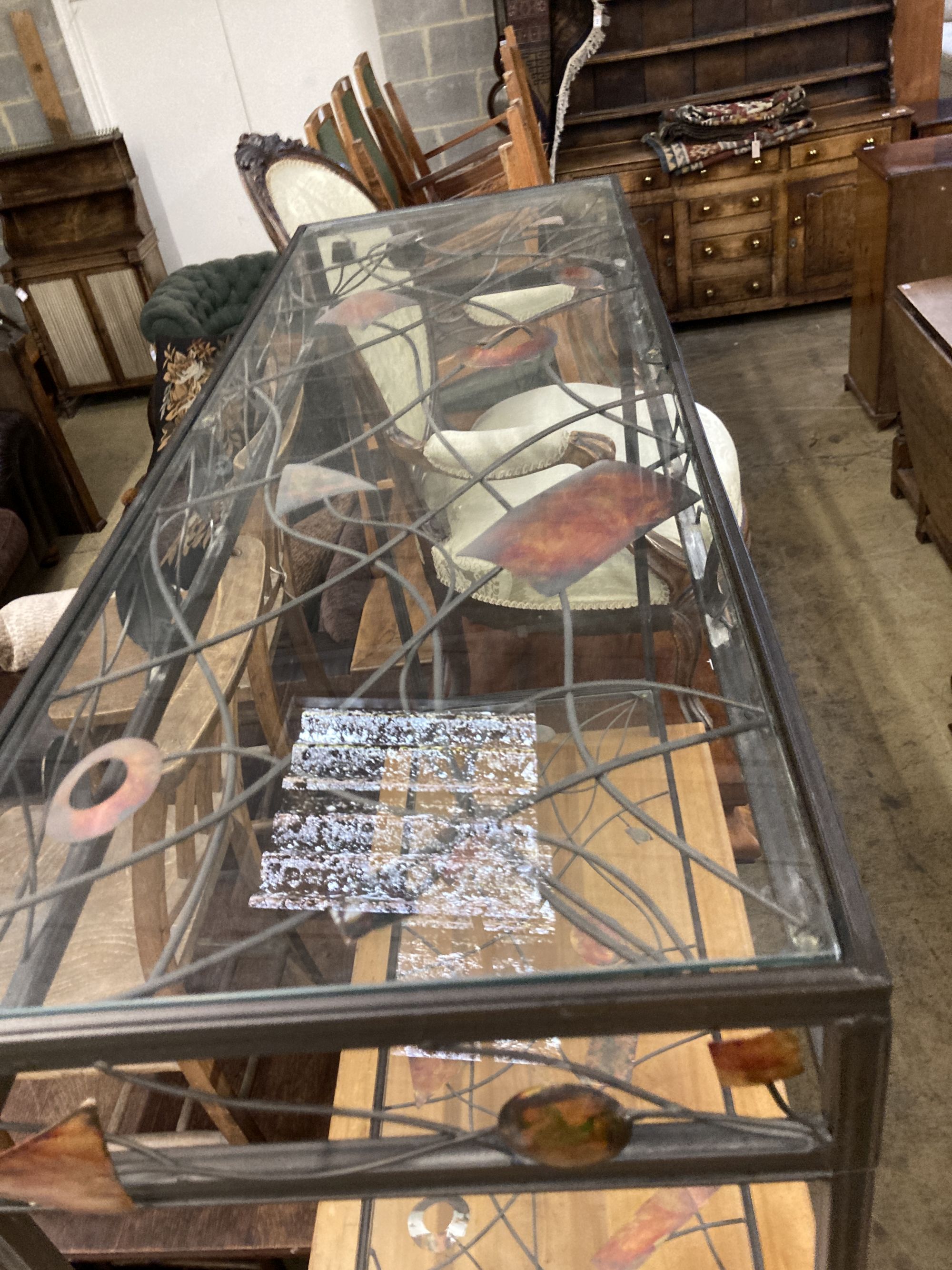 A contemporary metal and glass two tier console table, width 102cm, depth 36cm, height 80cm